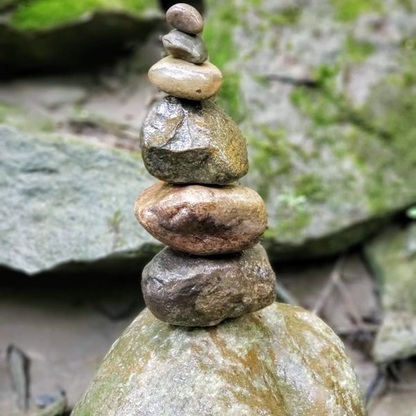 A serene landscape with balanced stones, symbolizing stability and peace.